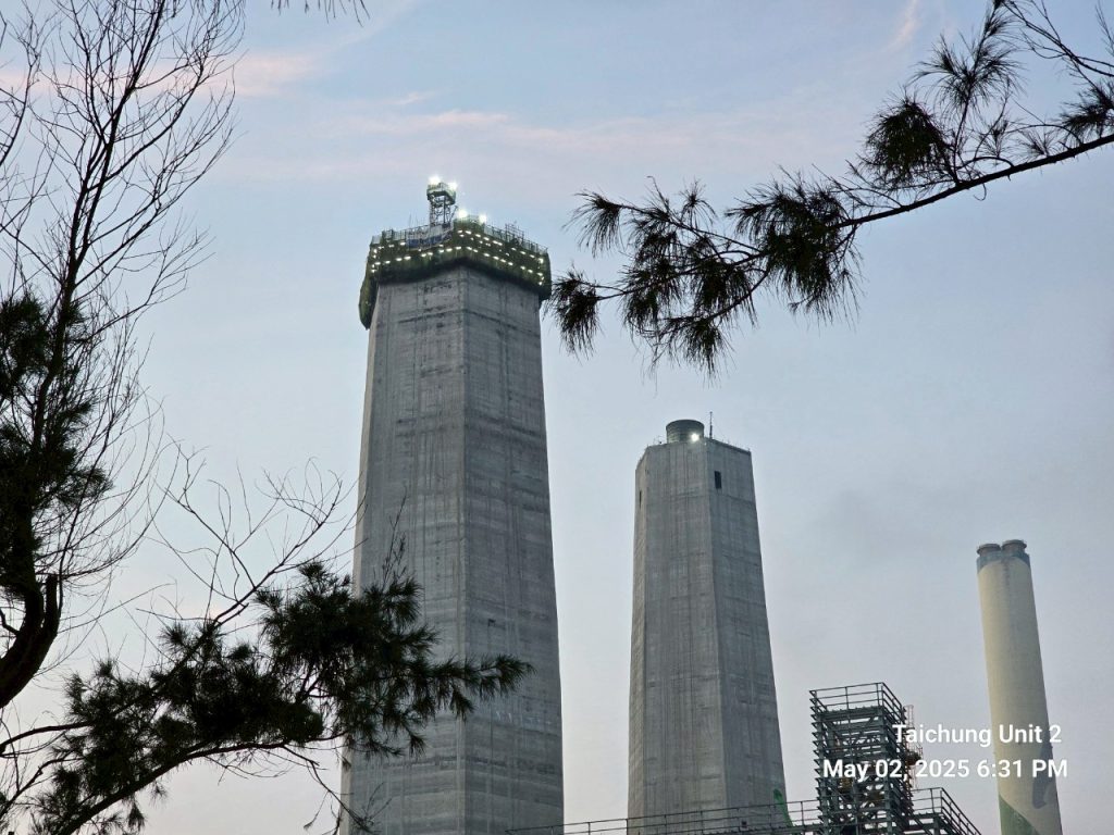 tow hexagonal shaped emission control structures at twilight at Taichung Power Plant