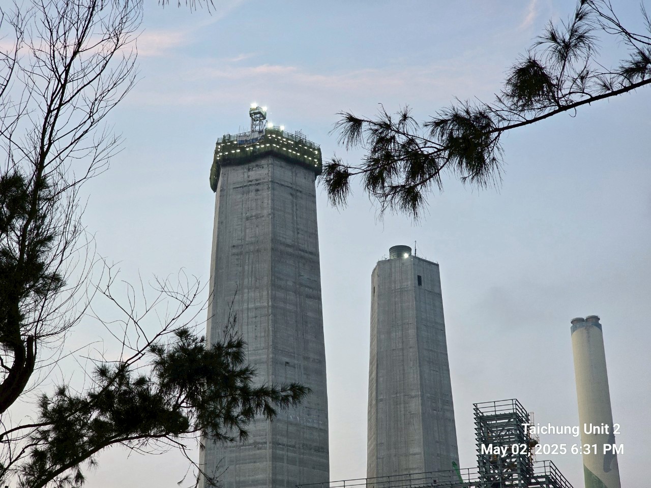 tow hexagonal shaped emission control structures at twilight at Taichung Power Plant
