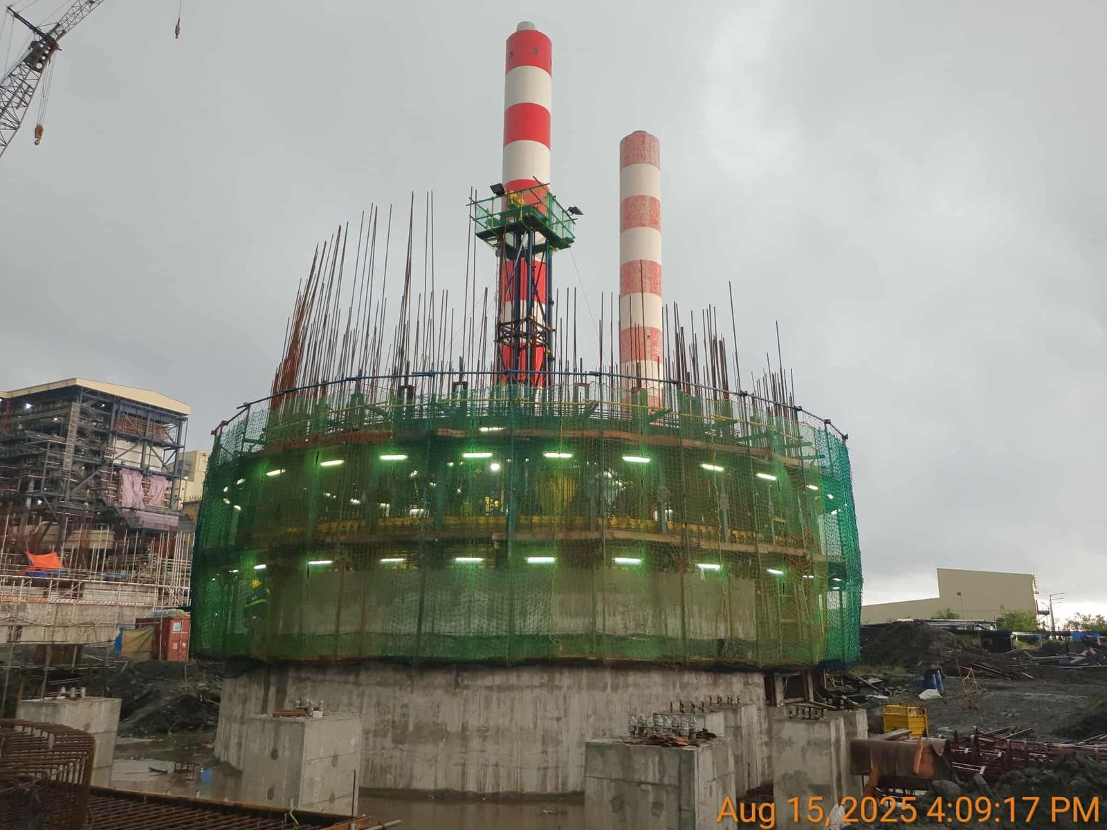 Slipform rig set up on large circular foundation ready to rise