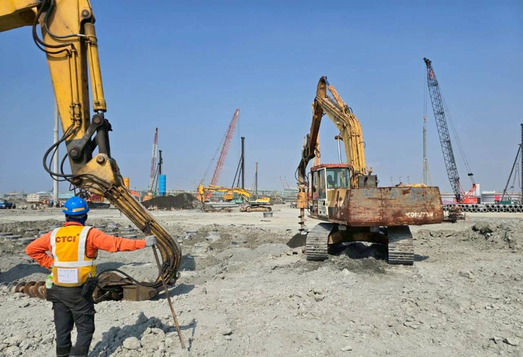 Heavy civil works underway at the Talin LNG Project in Taiwan, including excavation and piling operations for LNG tank foundations.